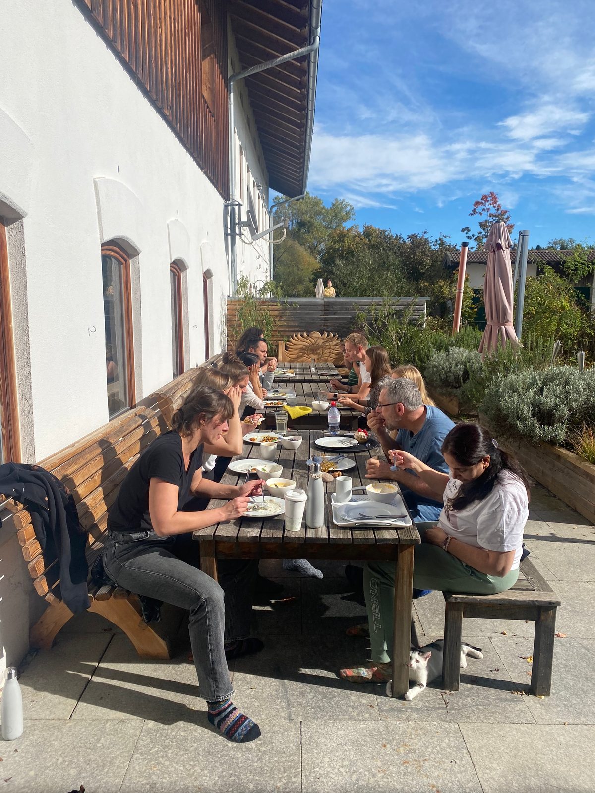 A cohort sharing lunch together at a retreat